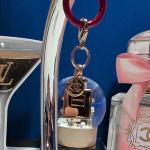 Gold Tone Perfume Bottle Bag Charm With Separate Tag